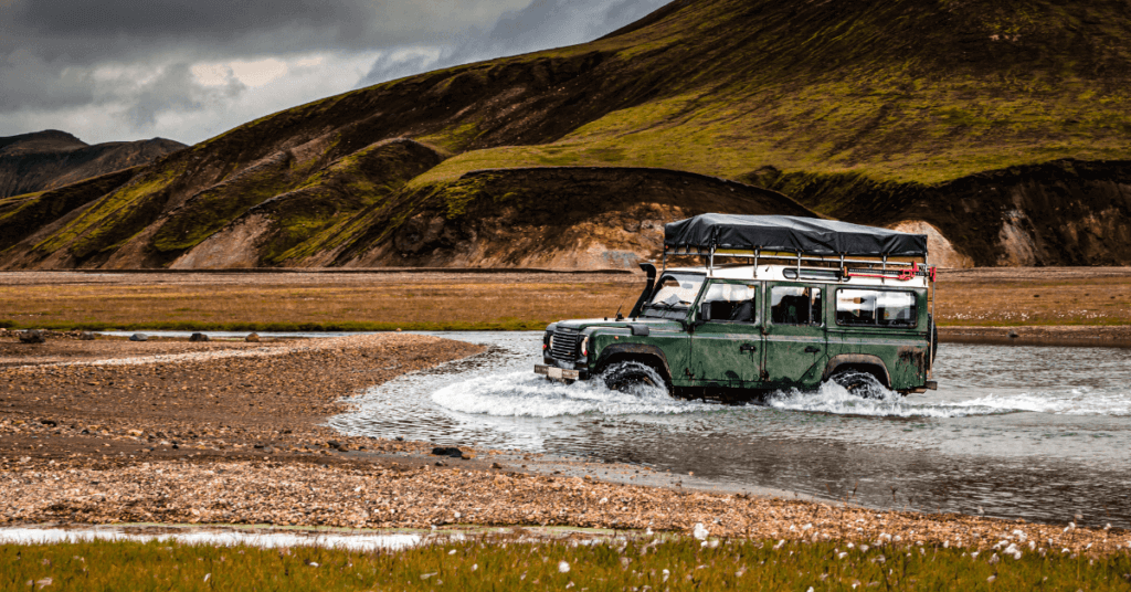 river crossing driving in iceland defender landrover
