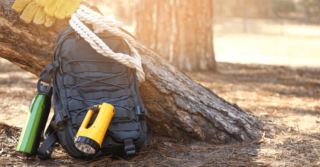 camping essentials backpack flashlight